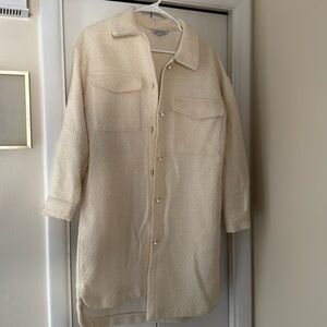 Woman’s long cream colored jacket. Size small but oversized. Not lined